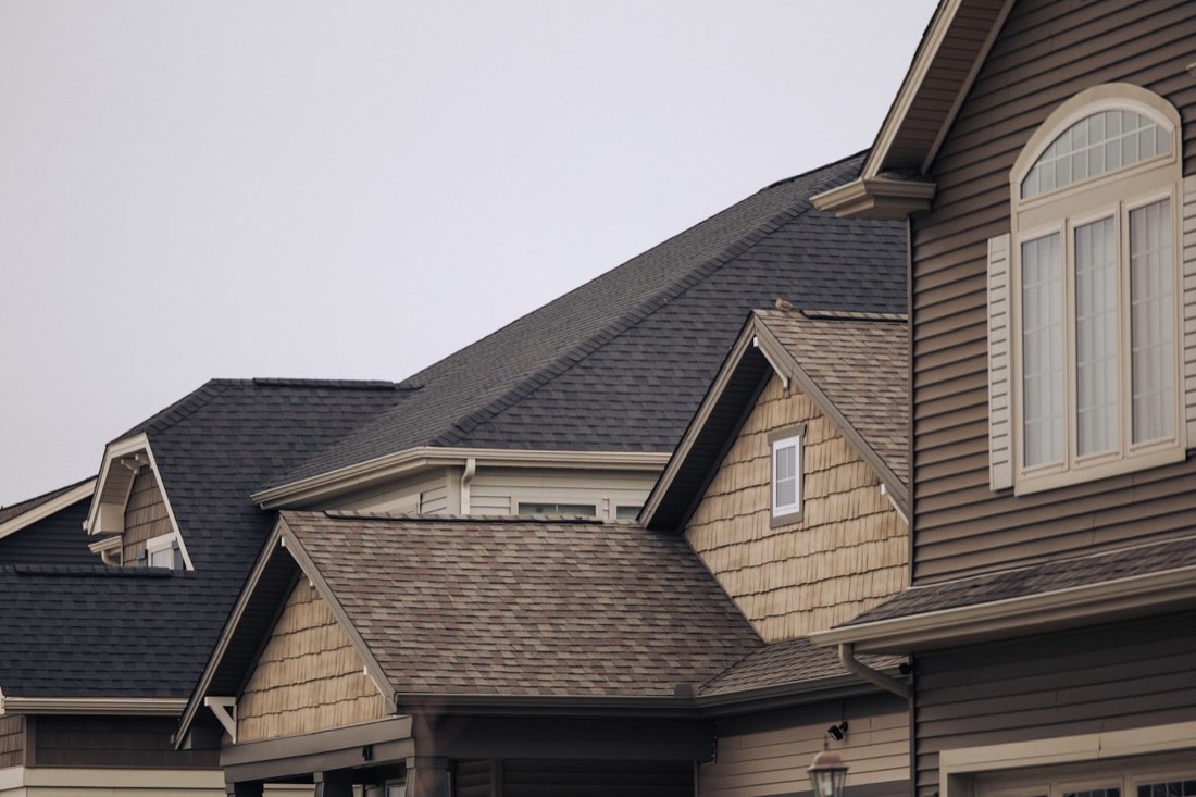 A row of Chattanooga-area homes with shingle roofs on a residential street